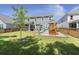 Fenced-in backyard featuring a screened-in porch and playground set, perfect for Gathering fun at 160 Cherry Grove Dr, Summerville, SC 29483