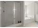 Bathroom featuring a large walk-in glass shower and a soaking tub by the window at 160 Cherry Grove Dr, Summerville, SC 29483