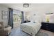 Stylish bedroom featuring a cozy reading chair and a plush bed with bright, cheerful decor at 160 Cherry Grove Dr, Summerville, SC 29483