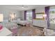 Bright bedroom with two beds, a dresser, and a colorful rug at 160 Cherry Grove Dr, Summerville, SC 29483