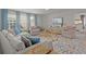 Bonus room with a large sectional, two chairs, and a colorful rug at 160 Cherry Grove Dr, Summerville, SC 29483