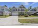 Charming two-story home with a manicured lawn, a two-car garage, and attractive landscaping at 160 Cherry Grove Dr, Summerville, SC 29483