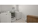 Well-lit laundry room with a full-size washer and dryer and a convenient storage shelf at 160 Cherry Grove Dr, Summerville, SC 29483
