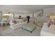 Expansive open-concept living space with living room, kitchen, dining area, and stairs, all in neutral decor at 160 Cherry Grove Dr, Summerville, SC 29483