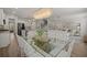 Open-concept living space features a modern kitchen, dining area, and elegant living room with lots of natural light at 160 Cherry Grove Dr, Summerville, SC 29483
