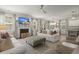 Bright and airy living space with a fireplace, TV, and comfortable seating, open to the dining and kitchen areas at 160 Cherry Grove Dr, Summerville, SC 29483