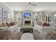 Beautifully decorated living room showcasing stylish seating, a fireplace with a TV, and elegant decor at 160 Cherry Grove Dr, Summerville, SC 29483