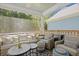 Comfortable outdoor patio area with wicker furniture, colorful cushions, and string lights at 160 Cherry Grove Dr, Summerville, SC 29483