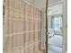 Shower area revealing bedroom with natural light, comfy bed, and a ceiling fan at 1600 Long Grove Drive # 811, Mount Pleasant, SC 29464