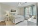 Cozy bedroom features a comfy bed, bright window, and a peaceful decor at 1600 Long Grove Drive # 811, Mount Pleasant, SC 29464