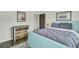 Inviting bedroom with decoratively painted dresser, hardwood floors, and natural lighting at 1600 Long Grove Drive # 811, Mount Pleasant, SC 29464