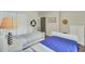 Bright bedroom with two beds, neutral walls, wood floors, and white trim at 1600 Long Grove Drive # 811, Mount Pleasant, SC 29464