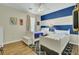 room features hardwood floors, two twin beds, and striped accent wall at 1600 Long Grove Drive # 811, Mount Pleasant, SC 29464