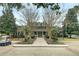 Beautiful brick clubhouse with manicured landscaping and inviting entrance, surrounded by mature trees and golf cart at 1600 Long Grove Drive # 811, Mount Pleasant, SC 29464