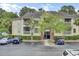 Exterior view of condominiums with ample parking spaces and lush landscaping at 1600 Long Grove Drive # 811, Mount Pleasant, SC 29464