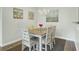 Dining area with seating for six, beachy decor and chandelier at 1600 Long Grove Drive # 811, Mount Pleasant, SC 29464