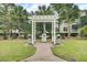 Outdoor grilling area with multiple grills and a charming pergola, perfect for community gatherings at 1600 Long Grove Drive # 811, Mount Pleasant, SC 29464