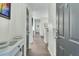 Hallway features wood floors, neutral walls, gray doors, and provides access to other rooms at 1600 Long Grove Drive # 811, Mount Pleasant, SC 29464