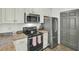 Well-equipped kitchen with stainless steel appliances, modern cabinets, and granite countertops at 1600 Long Grove Drive # 811, Mount Pleasant, SC 29464