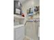 Efficient laundry area featuring a white washer and dryer with ample storage and shelving at 1600 Long Grove Drive # 811, Mount Pleasant, SC 29464