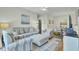 Comfortable living area showcasing a sofa, chairs, and a view of the dining space at 1600 Long Grove Drive # 811, Mount Pleasant, SC 29464