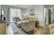 Bright living room with natural light, comfortable seating, and sliding glass door to balcony at 1600 Long Grove Drive # 811, Mount Pleasant, SC 29464