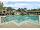 Large community pool surrounded by comfortable lounge chairs and well-maintained buildings at 1600 Long Grove Drive # 811, Mount Pleasant, SC 29464