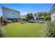 Green backyard with turf, seating and modern sunshade at 169 Callibluff Dr, Summerville, SC 29486