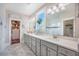 Bright bathroom featuring double sinks and vanity, a window with natural light, and an adjacent walk in closet at 169 Callibluff Dr, Summerville, SC 29486