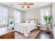 Comfortable bedroom with a ceiling fan, hardwood floors, a full length mirror, and bright, natural light at 169 Callibluff Dr, Summerville, SC 29486