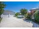 Long concrete driveway leading to a three-car garage and a backyard at 169 Callibluff Dr, Summerville, SC 29486