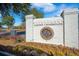 Beautiful Carnes Crossroads brick entrance sign surrounded by colorful landscaping and mature trees at 169 Callibluff Dr, Summerville, SC 29486