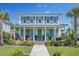 Charming two-story home featuring a welcoming front porch, beautiful landscaping, and classic architectural details at 169 Callibluff Dr, Summerville, SC 29486