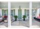 Inviting front porch adorned with potted plants and comfortable seating, creating a cozy outdoor space at 169 Callibluff Dr, Summerville, SC 29486