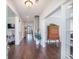 Inviting hallway with hardwood floors, white trim, and an open floor plan leading to various rooms at 169 Callibluff Dr, Summerville, SC 29486