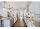 Well-equipped kitchen with stainless steel appliances, granite countertops, and ample cabinet space, perfect for cooking at 169 Callibluff Dr, Summerville, SC 29486