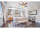 Spacious main bedroom featuring a decorative ceiling fan, bench seat, and a plush area rug at 169 Callibluff Dr, Summerville, SC 29486
