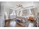 Spacious main bedroom featuring a decorative ceiling fan, bench seat, and a plush area rug at 169 Callibluff Dr, Summerville, SC 29486