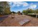 Shaded playground with play structure, swings, and a small wooden bridge for community entertainment at 169 Callibluff Dr, Summerville, SC 29486