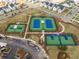 Aerial view of tennis and pickleball courts in a well-maintained community with manicured landscaping and ample parking at 169 Callibluff Dr, Summerville, SC 29486