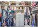 Organized walk-in closet featuring multiple racks of clothes, shelving and drawers for optimal storage at 169 Callibluff Dr, Summerville, SC 29486