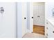 Bathroom view with shower, toilet, and plenty of storage in the white cabinets at 1701 A Palmetto Blvd, Edisto Island, SC 29438
