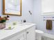 Well-lit bathroom featuring a vanity with a white countertop and modern fixtures at 1701 A Palmetto Blvd, Edisto Island, SC 29438
