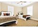 Cozy bedroom featuring two beds, natural light and hardwood floors at 1701 A Palmetto Blvd, Edisto Island, SC 29438