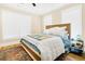 Cozy bedroom with neutral tones, large windows, and stylish decor with an area rug at 1701 A Palmetto Blvd, Edisto Island, SC 29438
