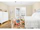 Comfortable bedroom with a white dresser, neutral decor, and natural light from the window at 1701 A Palmetto Blvd, Edisto Island, SC 29438
