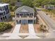 Charming coastal home featuring a spacious wrap-around porch and convenient drive-under parking at 1701 A Palmetto Blvd, Edisto Island, SC 29438