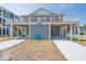 Charming coastal home with elevated structure, showcasing the home's unique design at 1701 A Palmetto Blvd, Edisto Island, SC 29438