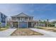 Charming elevated beach house featuring a spacious porch, ground-level parking, and a well-maintained exterior at 1701 A Palmetto Blvd, Edisto Island, SC 29438