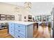 Open-concept living space features a kitchen island and dining table, ideal for gatherings at 1701 A Palmetto Blvd, Edisto Island, SC 29438